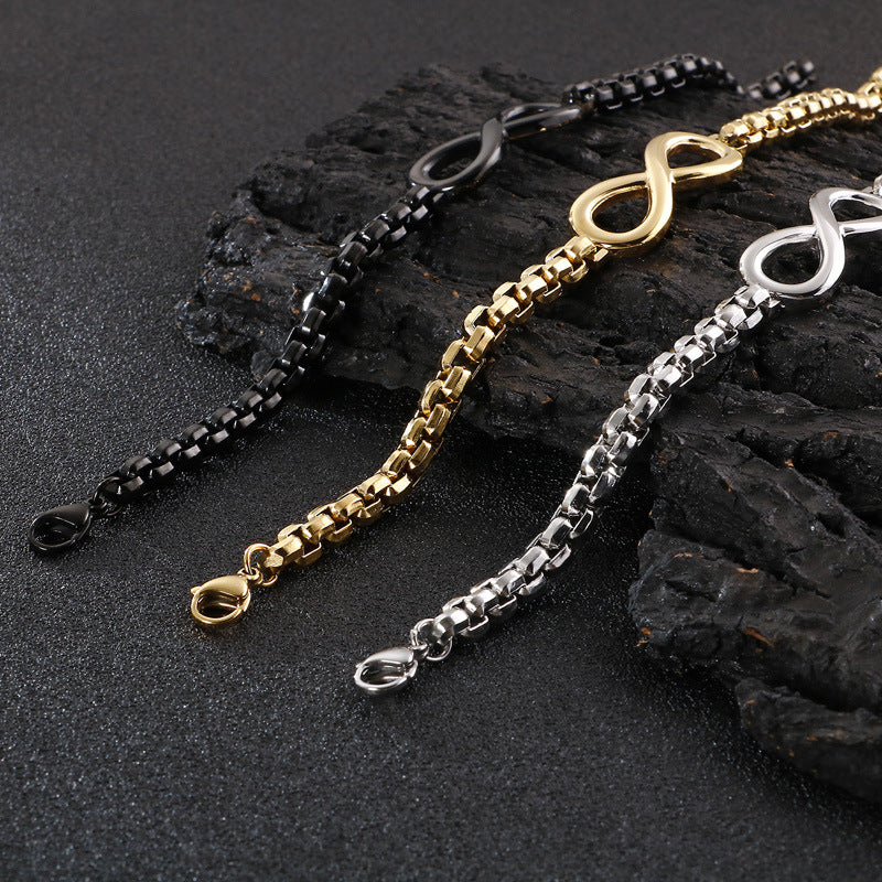 The Infinity bracelet clasp detail in silver, black, and gold stainless steel