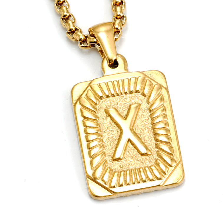 The Initial gold stainless steel letter X pendant, studio shot
