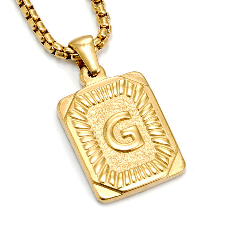 The Initial gold stainless steel letter G pendant, studio shot