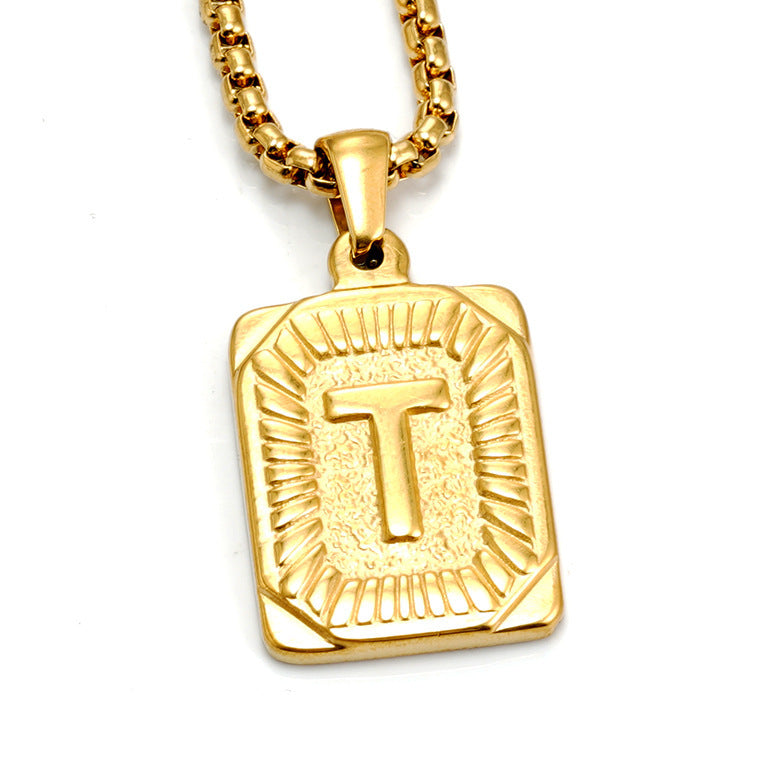 The Initial gold stainless steel letter T pendant, studio shot