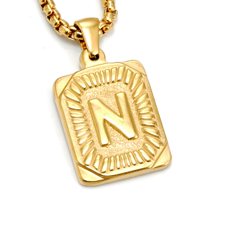 The Initial gold stainless steel letter N pendant, studio shot