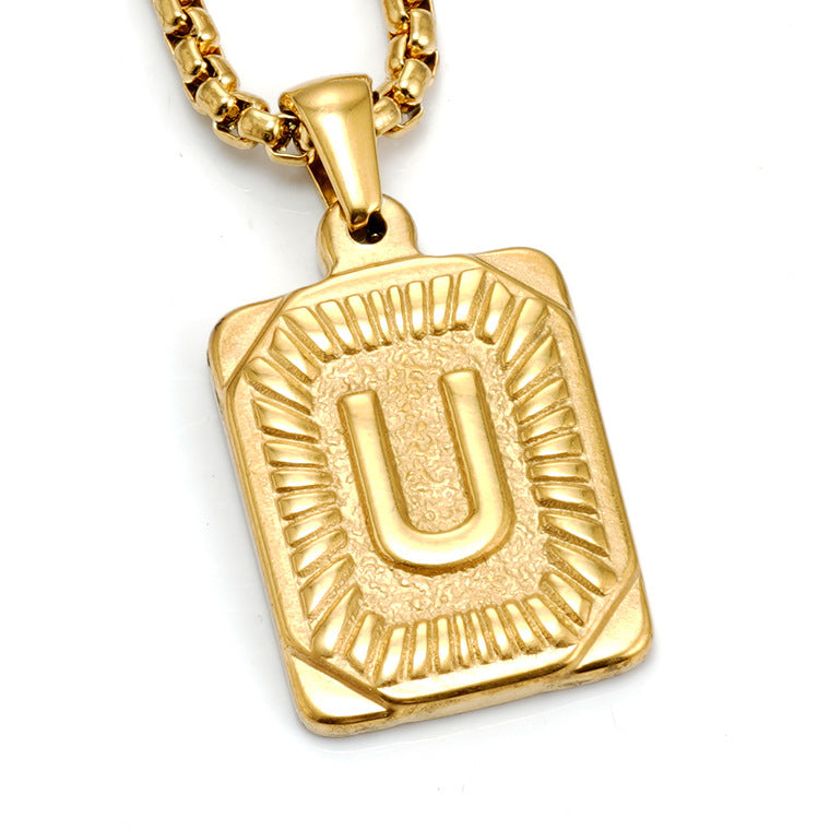 The Initial gold stainless steel letter U pendant, studio shot