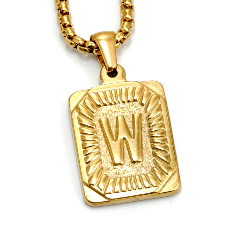 The Initial gold stainless steel letter W pendant, studio shot
