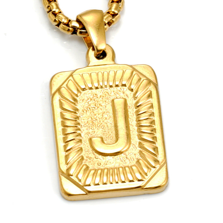 The Initial gold stainless steel letter J pendant, studio shot