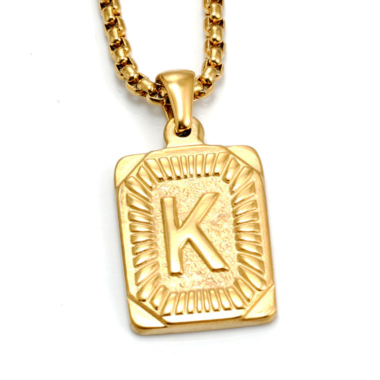 The Initial gold stainless steel letter K pendant, studio shot