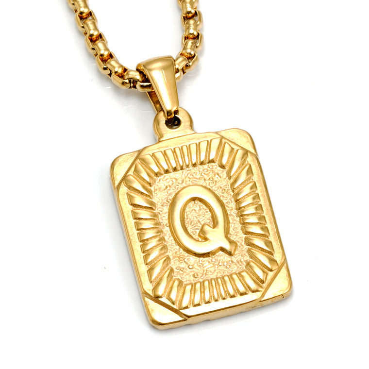 The Initial gold stainless steel letter Q pendant, studio shot