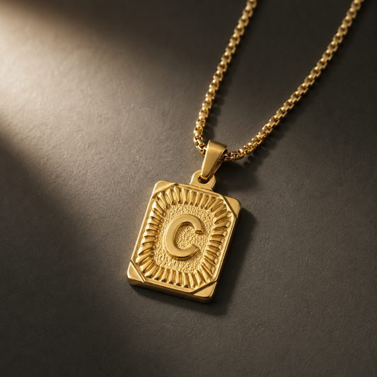 The Initial gold stainless steel letter C pendant, close-up
