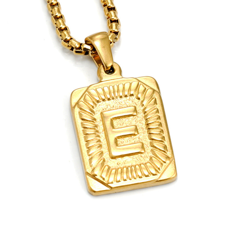 The Initial gold stainless steel letter E pendant, studio shot