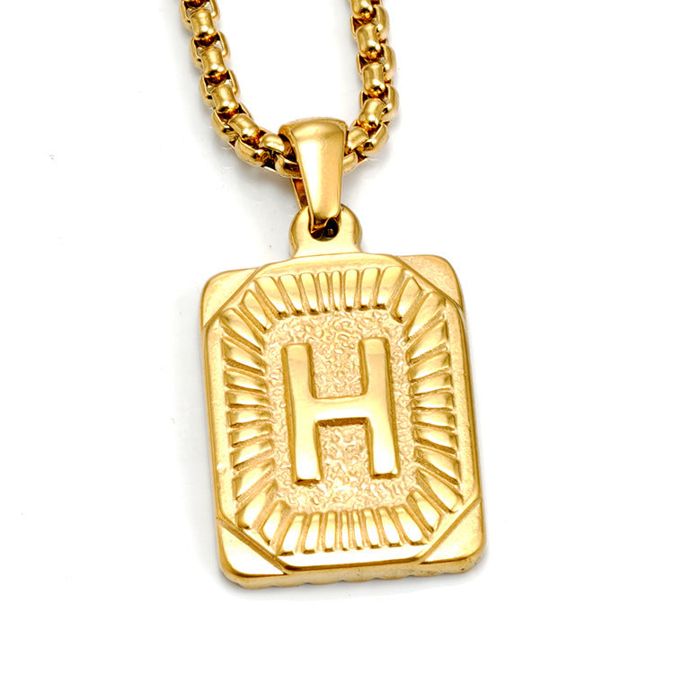 The Initial gold stainless steel letter H pendant, studio shot