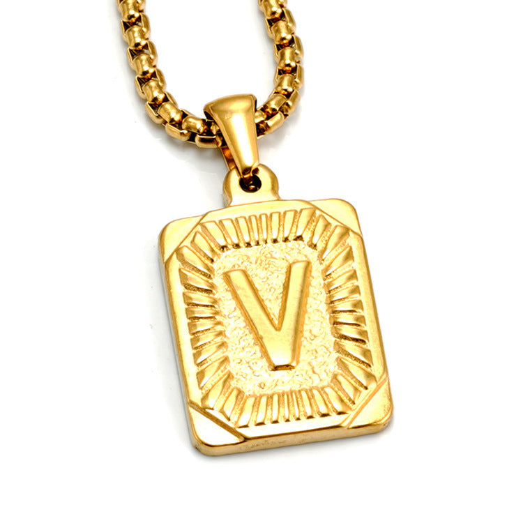 The Initial gold stainless steel letter V pendant, studio shot